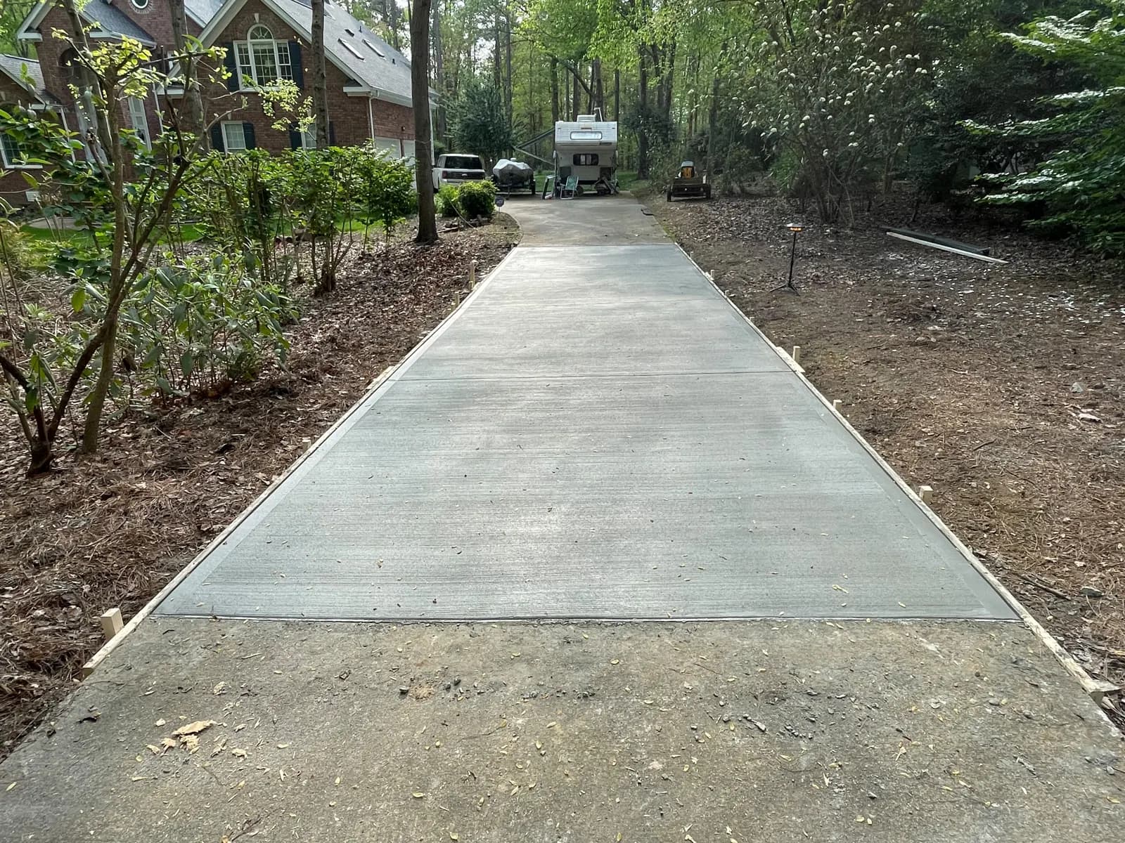 Finished concrete driveway leading to the house