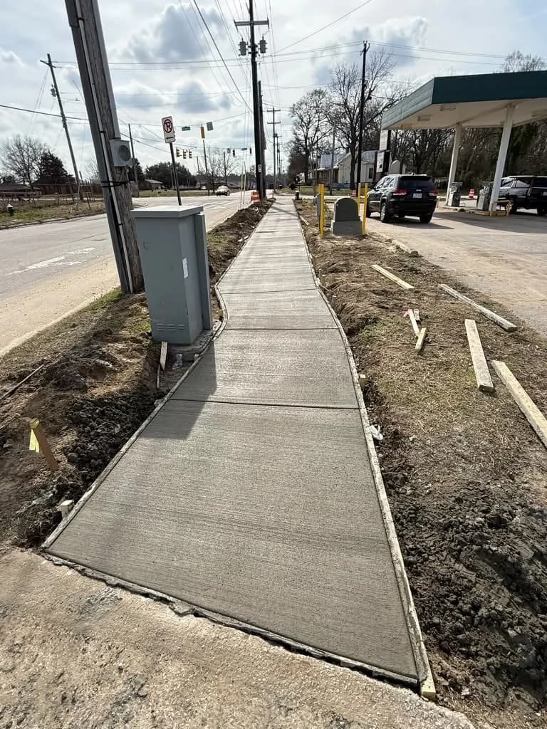 Finished concrete sidewalk along the road